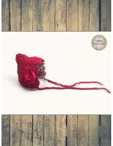 Red pixie baby bonnet with flower